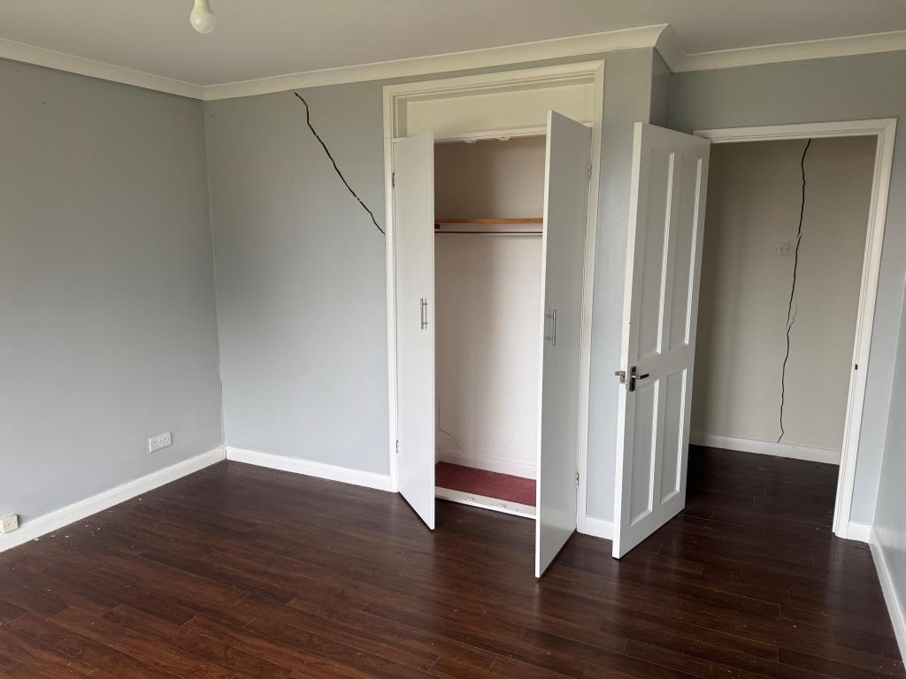 Lot: 142 - DETACHED BUNGALOW WITH STRUCTURAL MOVEMENT - A View of one of the Bedrooms looking backwards the hall